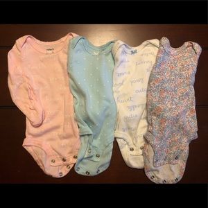 Lot of Carter’s long-sleeve onesies